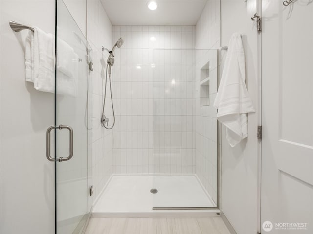 bathroom with a shower stall