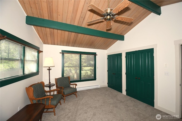 living area featuring carpet, a healthy amount of sunlight, baseboard heating, and vaulted ceiling with beams