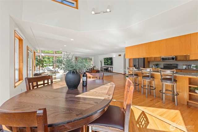 dining room with light wood-style flooring