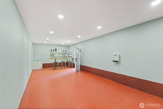 interior space with tile patterned floors and recessed lighting
