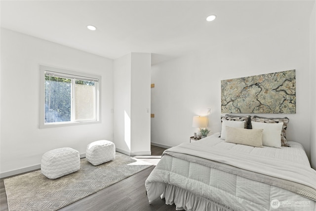 bedroom featuring baseboards, recessed lighting, and wood finished floors
