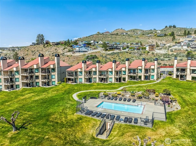 birds eye view of property with a mountain view
