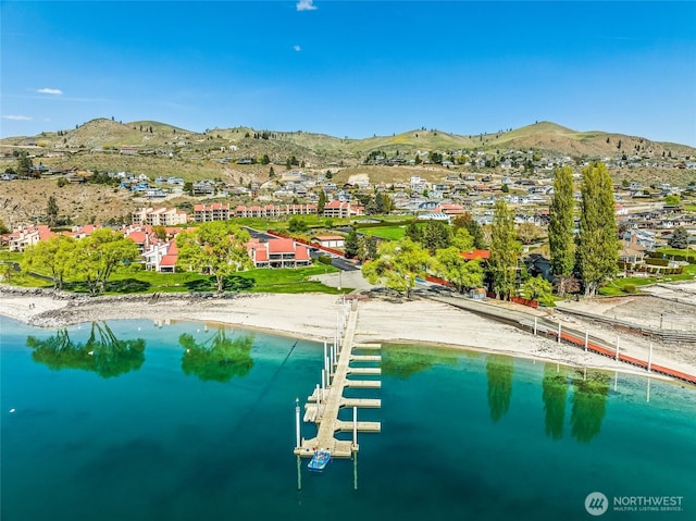 drone / aerial view with a residential view and a water and mountain view