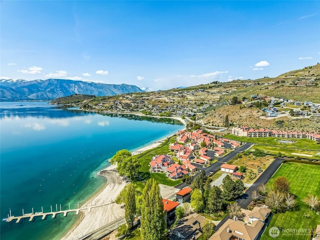aerial view featuring a water and mountain view