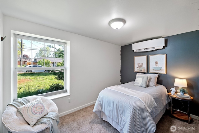 carpeted bedroom featuring an AC wall unit and baseboards