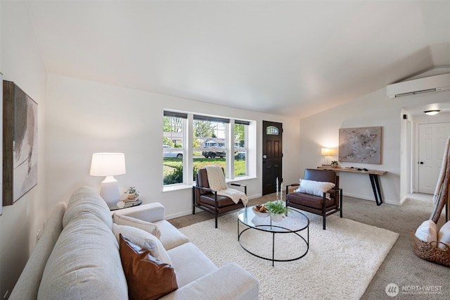 living area featuring carpet floors, baseboards, a wall mounted AC, and lofted ceiling