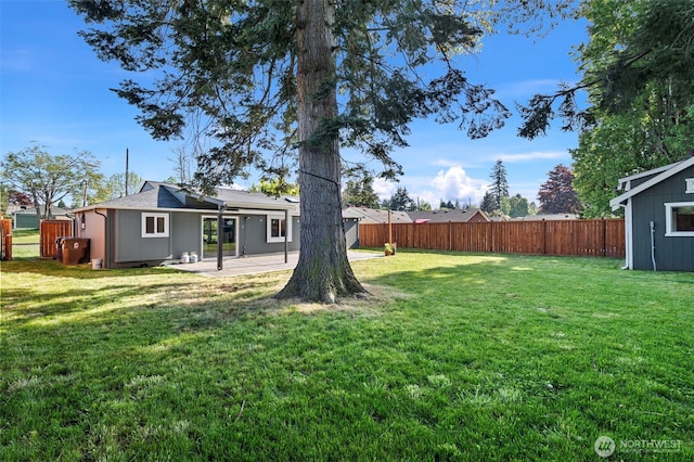 view of yard featuring fence and a patio area