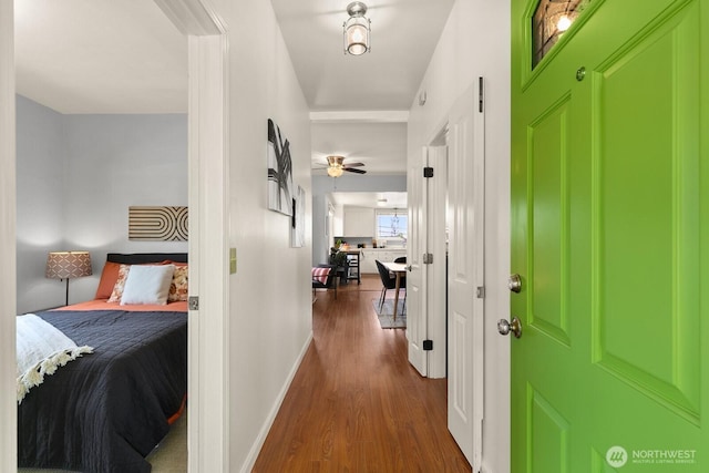 6357 37th Ave SW, Seattle, WA 98126 - hallway featuring dark wood-type flooring and baseboards