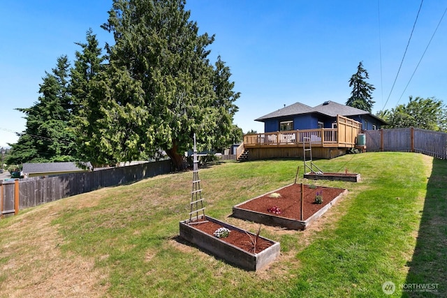 6357 37th Ave SW, Seattle, WA 98126 - view of yard featuring a vegetable garden and a wooden deck