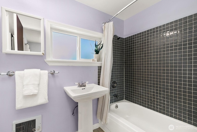 6357 37th Ave SW, Seattle, WA 98126 - full bathroom with shower / bath combination with curtain, heating unit, and a sink