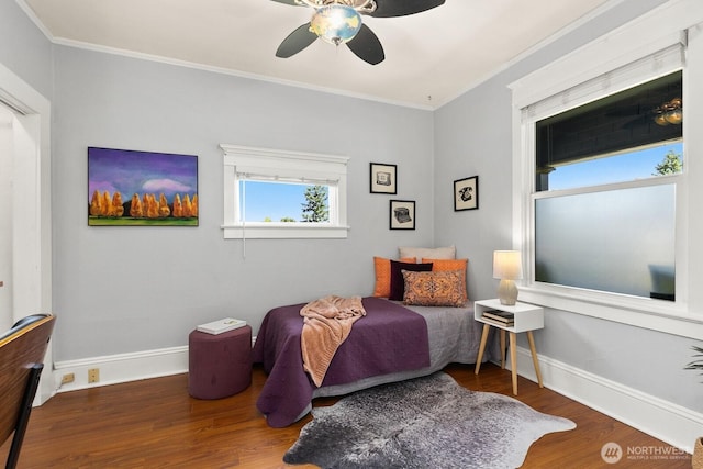 6357 37th Ave SW, Seattle, WA 98126 - bedroom with ornamental molding, wood finished floors, baseboards, and ceiling fan