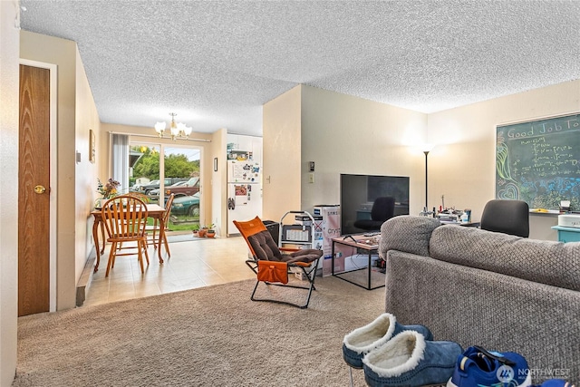 living area featuring carpet flooring, a textured ceiling, and a notable chandelier