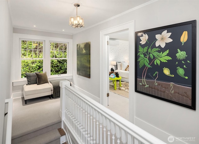 hall with carpet floors, ornamental molding, a wall unit AC, and an inviting chandelier