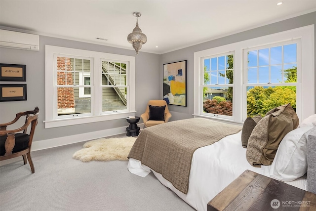 bedroom with an AC wall unit, carpet, recessed lighting, baseboards, and visible vents