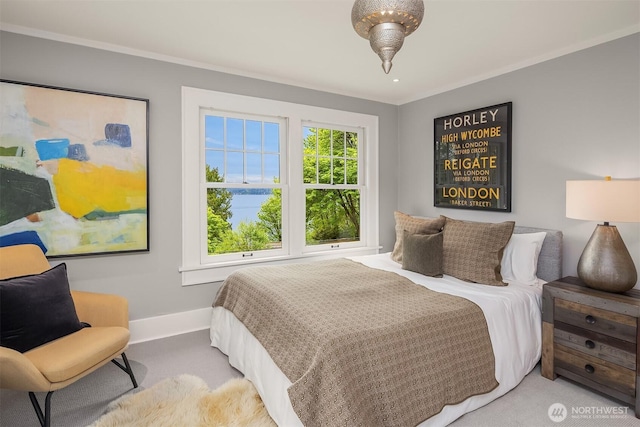 carpeted bedroom featuring baseboards