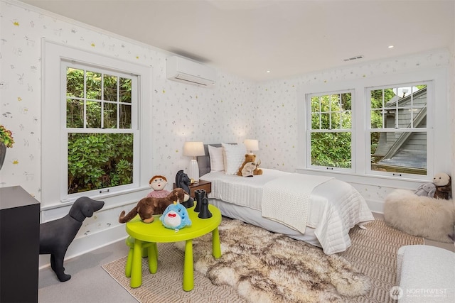 carpeted bedroom with visible vents, a wall mounted AC, multiple windows, and wallpapered walls