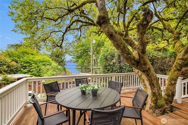 wooden deck with outdoor dining area