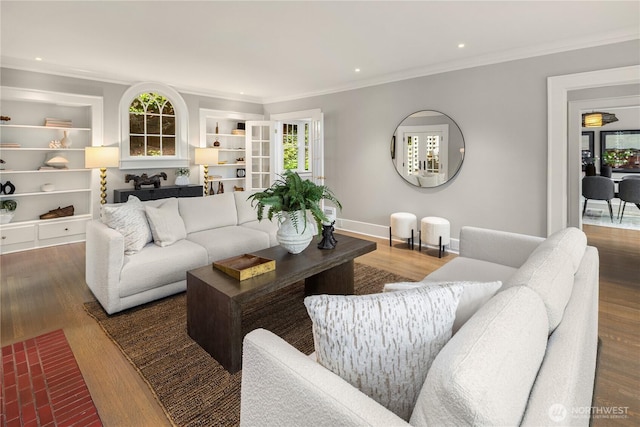 living area with crown molding, recessed lighting, and wood finished floors