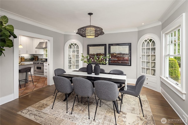 dining space with recessed lighting, ornamental molding, and a healthy amount of sunlight