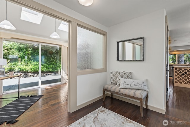 2716 58th Street Ct NW, Gig Harbor, WA 98335 - sitting room featuring dark wood-style flooring, a skylight, and baseboards
