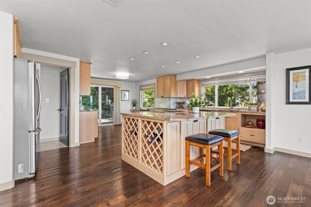 2716 58th Street Ct NW, Gig Harbor, WA 98335 - kitchen with freestanding refrigerator, light brown cabinetry, recessed lighting, a center island, and dark wood-style floors