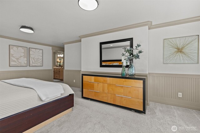 2716 58th Street Ct NW, Gig Harbor, WA 98335 - bedroom featuring light colored carpet, ornamental molding, ensuite bathroom, and a wainscoted wall