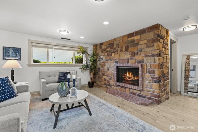 2716 58th Street Ct NW, Gig Harbor, WA 98335 - living room with baseboards, a fireplace, visible vents, and wood finished floors