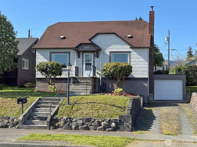 view of front of property with a garage, a front lawn, a chimney, and driveway