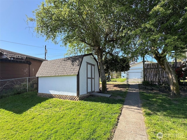 view of shed featuring a fenced backyard
