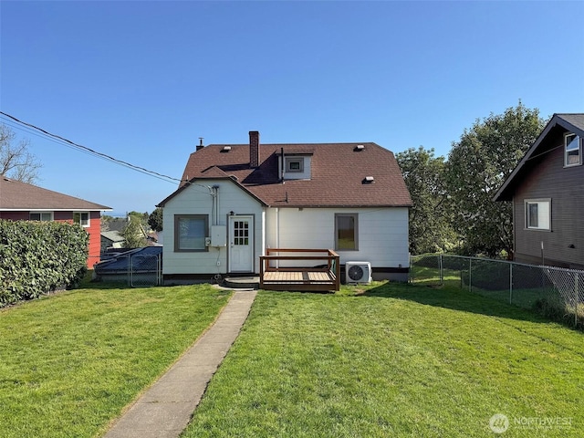 back of house featuring a deck, a fenced backyard, ac unit, a lawn, and a shingled roof