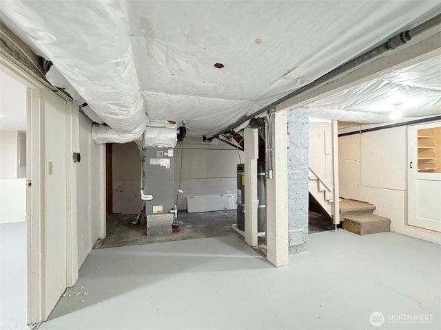 unfinished below grade area with stairway and heating unit