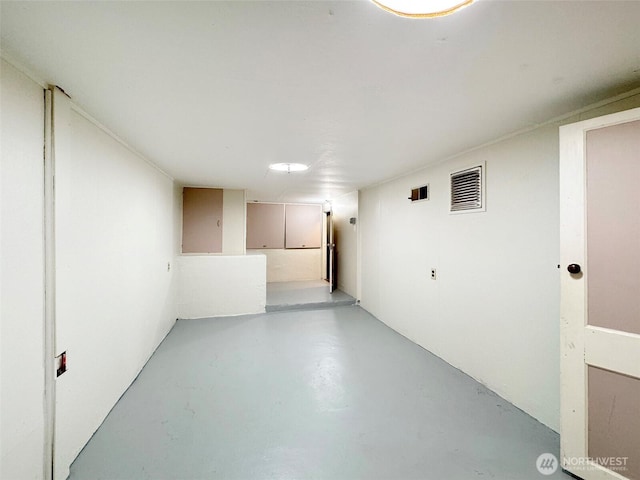 interior space with finished concrete flooring and visible vents