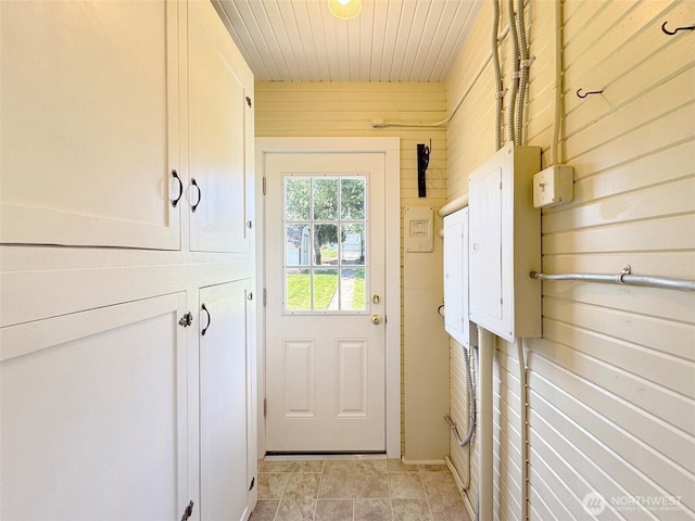 doorway with wooden ceiling and electric panel