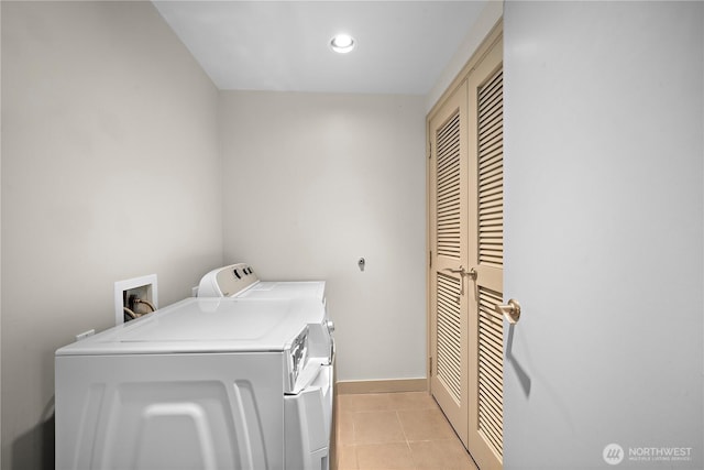 10610 NE 9th Pl Unit G403, Bellevue, WA 98004 - washroom featuring washer and dryer, light tile patterned floors, baseboards, and recessed lighting