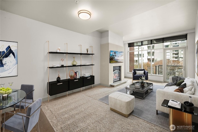 10610 NE 9th Pl Unit G403, Bellevue, WA 98004 - living room with carpet, a glass covered fireplace, and baseboards