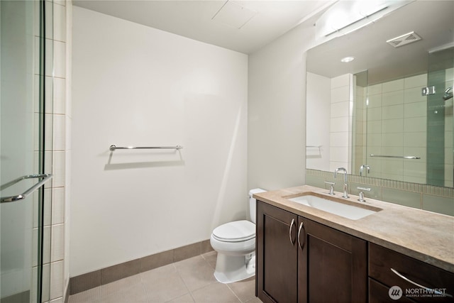10610 NE 9th Pl Unit G403, Bellevue, WA 98004 - bathroom featuring tile patterned floors, toilet, baseboards, and a shower with shower door