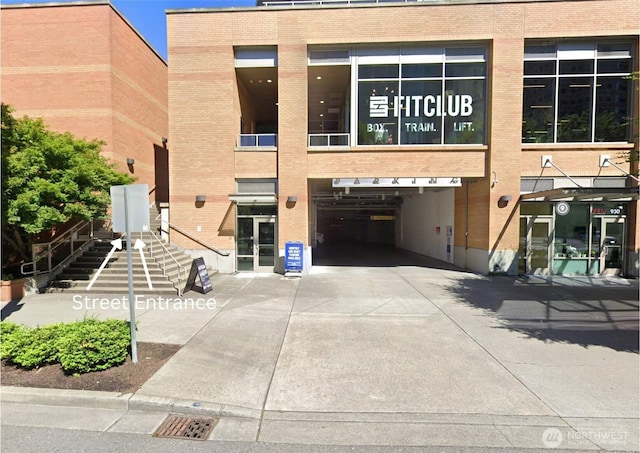 10610 NE 9th Pl Unit G403, Bellevue, WA 98004 - view of building exterior with driveway