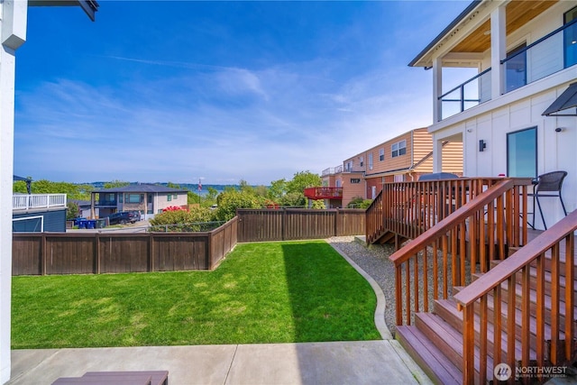 3315 N 35th St, Tacoma, WA 98407 - view of yard featuring stairway, a residential view, a fenced backyard, and a wooden deck