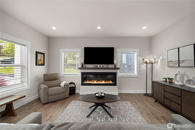 3315 N 35th St, Tacoma, WA 98407 - living room with recessed lighting, baseboards, a glass covered fireplace, and wood finished floors