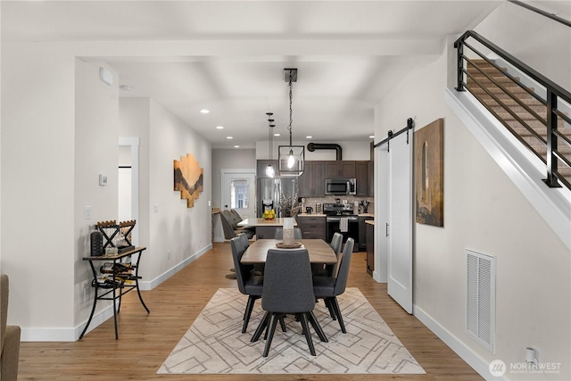 3315 N 35th St, Tacoma, WA 98407 - dining space with light wood-style floors, stairs, recessed lighting, baseboards, and visible vents