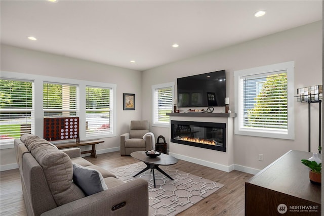 3315 N 35th St, Tacoma, WA 98407 - living room with a glass covered fireplace, baseboards, recessed lighting, and wood finished floors