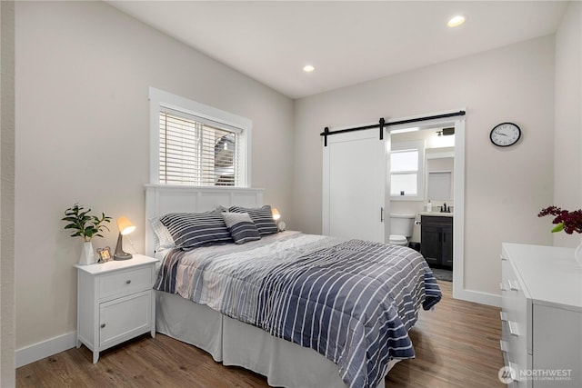 3315 N 35th St, Tacoma, WA 98407 - bedroom featuring baseboards, a barn door, wood finished floors, and recessed lighting