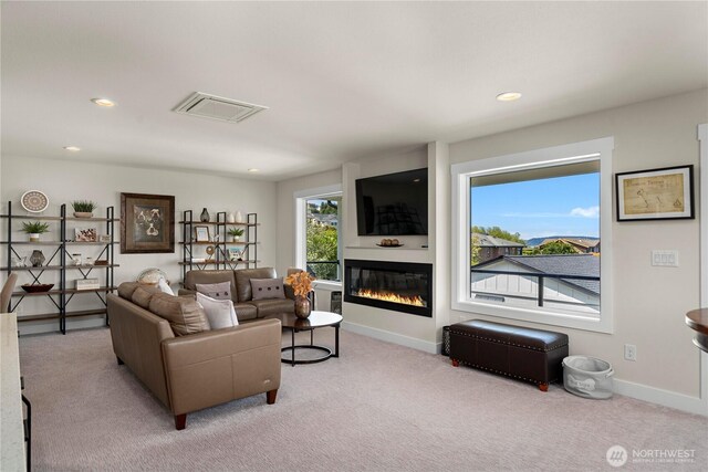 3315 N 35th St, Tacoma, WA 98407 - carpeted living area featuring recessed lighting, baseboards, visible vents, and a glass covered fireplace