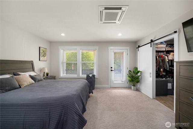 3315 N 35th St, Tacoma, WA 98407 - bedroom featuring visible vents, access to exterior, a walk in closet, recessed lighting, and a barn door