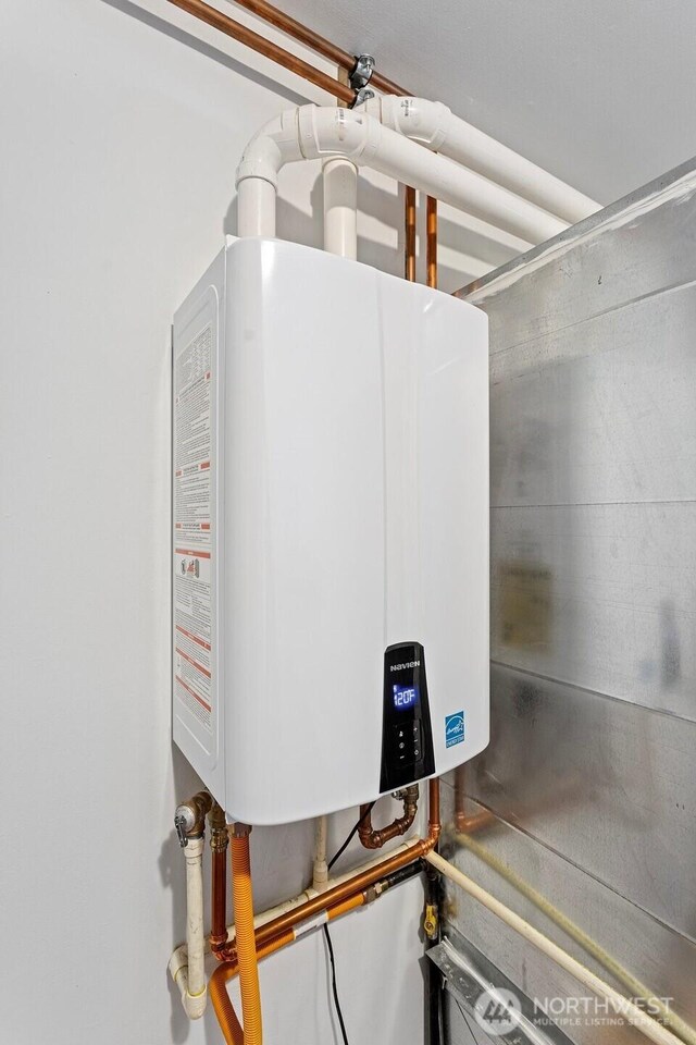 utility room with water heater