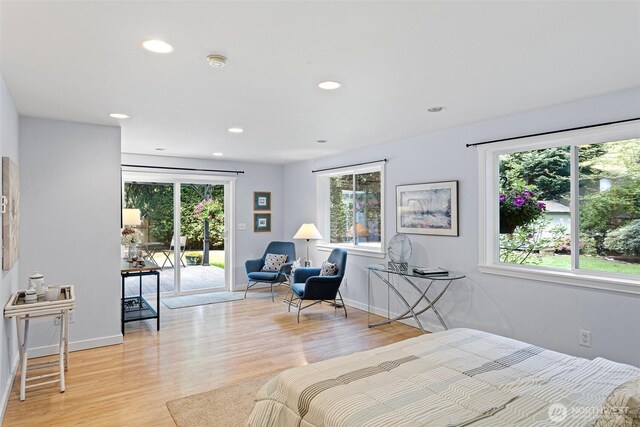 bedroom with recessed lighting, baseboards, access to exterior, and light wood-style floors
