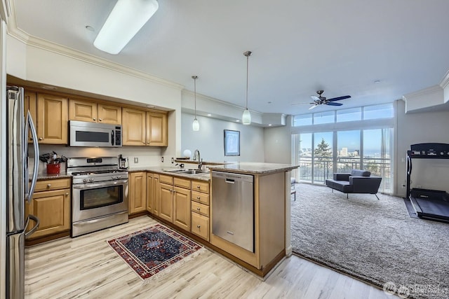 320 E 32nd St Unit 105, Tacoma, WA 98404 - kitchen with stainless steel appliances, open floor plan, ornamental molding, and a peninsula