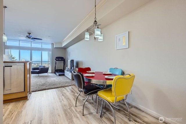 320 E 32nd St Unit 105, Tacoma, WA 98404 - dining area featuring baseboards, floor to ceiling windows, ornamental molding, wood finished floors, and a ceiling fan