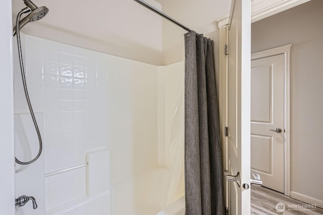 320 E 32nd St Unit 105, Tacoma, WA 98404 - full bath with shower / bath combo with shower curtain and wood finished floors
