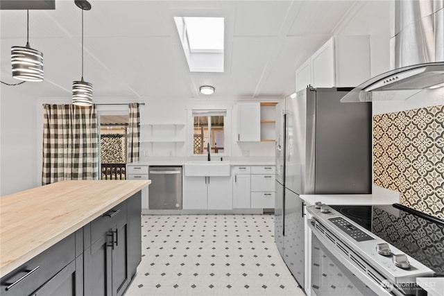 607 37th St SE Unit 92, Auburn, WA 98002 - kitchen featuring stainless steel dishwasher, open shelves, range with electric cooktop, a sink, and wall chimney exhaust hood